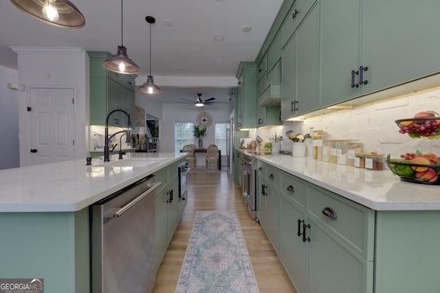 4492 Bryten Dr, Douglasville, GA 30135 - kitchen with dishwasher, green cabinetry, tasteful backsplash, a sink, and ornamental molding