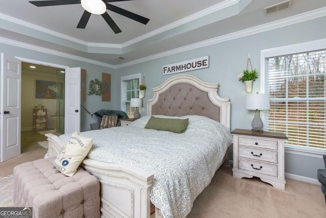 4492 Bryten Dr, Douglasville, GA 30135 - bedroom with light colored carpet, ornamental molding, baseboards, a ceiling fan, and ensuite bath