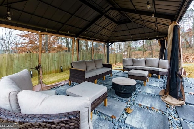 4492 Bryten Dr, Douglasville, GA 30135 - fenced backyard with an outdoor living space, a gazebo, and a patio
