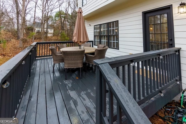 4492 Bryten Dr, Douglasville, GA 30135 - wooden terrace with outdoor dining area