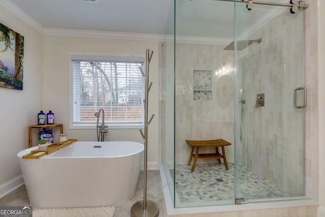 4492 Bryten Dr, Douglasville, GA 30135 - full bathroom featuring ornamental molding, a freestanding tub, a stall shower, and baseboards