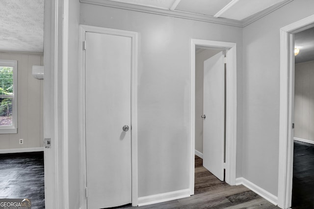 interior space with dark hardwood / wood-style floors and a textured ceiling