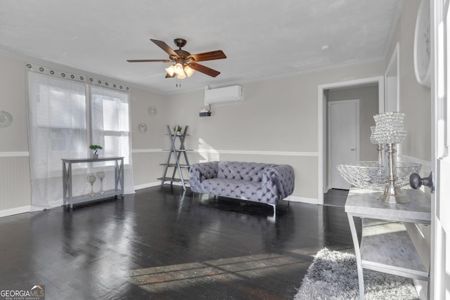 sitting room featuring ceiling fan, crown molding, dark hardwood / wood-style floors, and a wall mounted AC