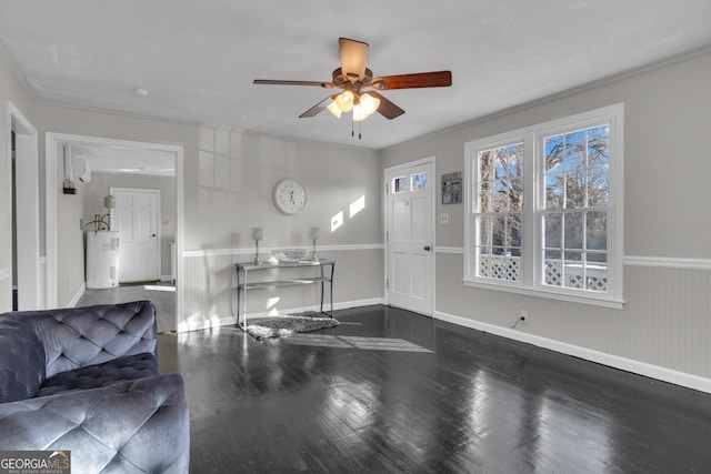 living room with water heater, crown molding, ceiling fan, and dark hardwood / wood-style flooring