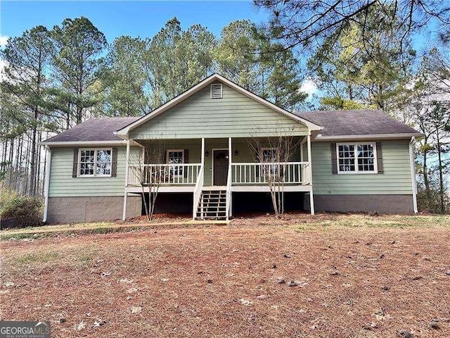 ranch-style house featuring covered porch