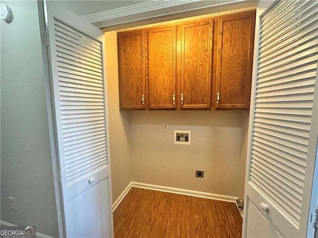 clothes washing area with dark hardwood / wood-style flooring, hookup for a washing machine, cabinets, and hookup for an electric dryer