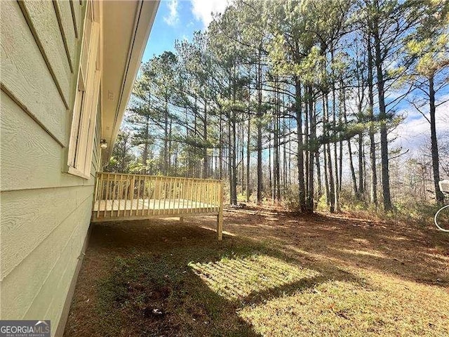 view of yard with a wooden deck