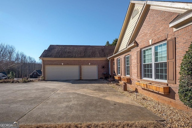 view of side of home with a garage