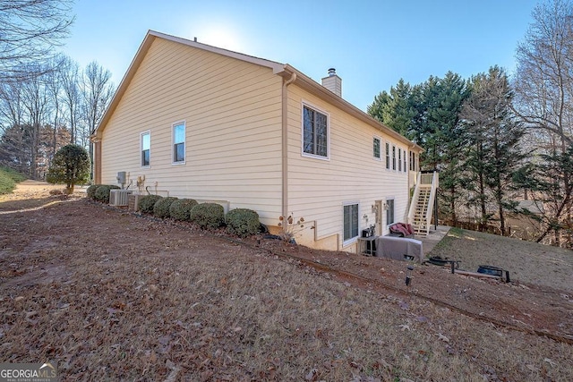 view of home's exterior with central AC