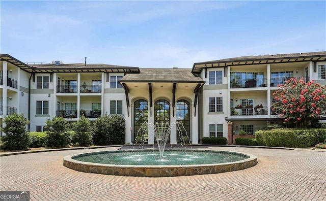 view of swimming pool with pool water feature