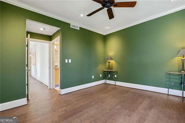 unfurnished room with ceiling fan, wood-type flooring, and crown molding