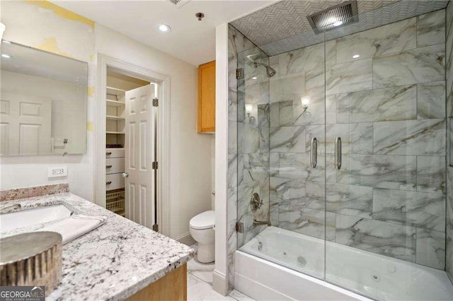 full bathroom featuring vanity, toilet, and enclosed tub / shower combo