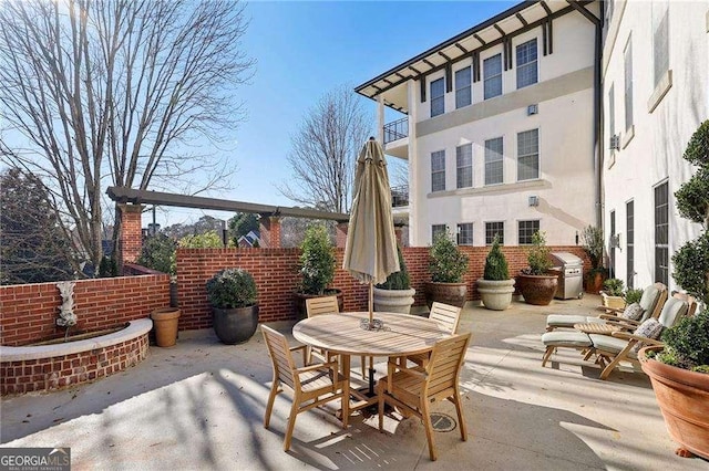 view of patio with a balcony