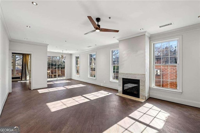 unfurnished living room with ceiling fan, crown molding, a high end fireplace, and dark hardwood / wood-style floors