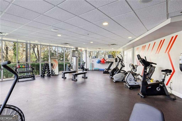 workout area featuring floor to ceiling windows