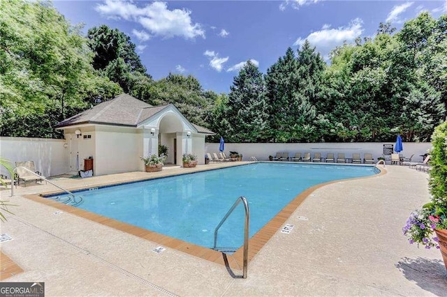 view of swimming pool with a patio