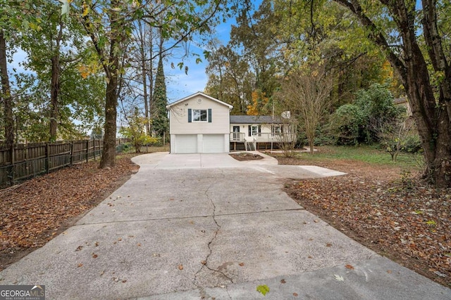 view of front facade with a garage and a deck