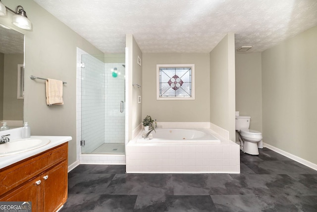 full bathroom with vanity, separate shower and tub, toilet, and a textured ceiling