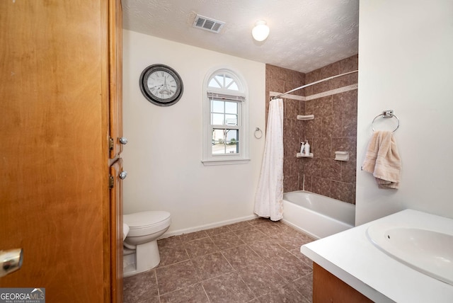 full bathroom with shower / bath combo with shower curtain, vanity, a textured ceiling, and toilet