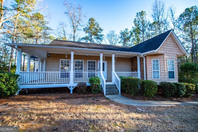 ranch-style house with covered porch