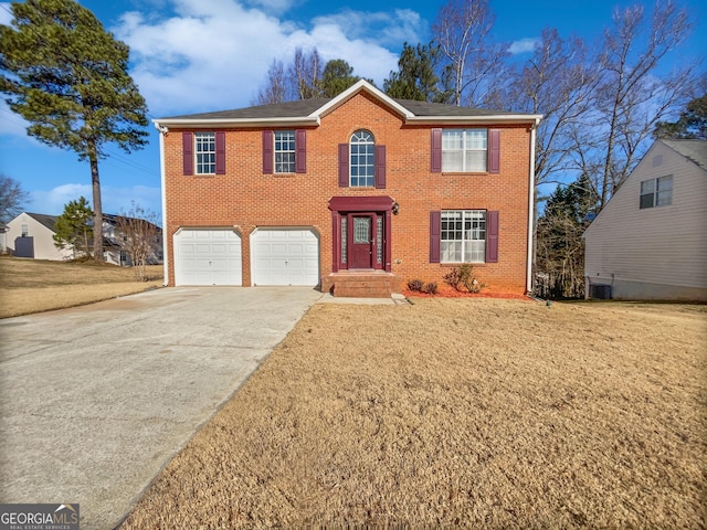 view of front facade with a garage and cooling unit