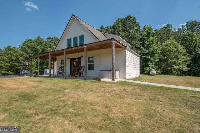 rear view of house featuring a lawn and a patio area