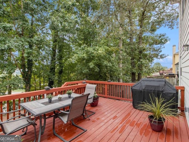 wooden deck with grilling area