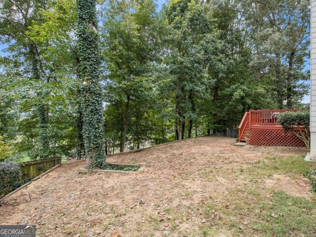 view of yard featuring a wooden deck