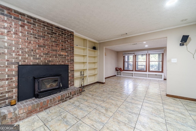 unfurnished living room featuring built in shelves, a textured ceiling, tile patterned flooring, and crown molding