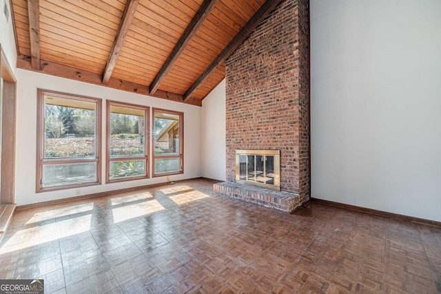 unfurnished living room featuring a brick fireplace, wooden ceiling, high vaulted ceiling, beamed ceiling, and parquet floors