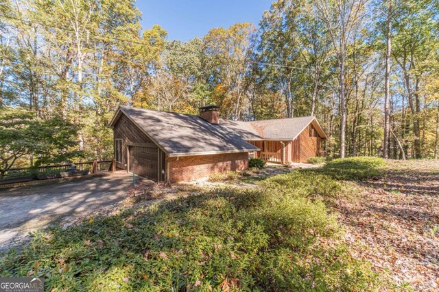 view of side of home featuring a garage