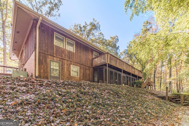 rear view of property with a balcony