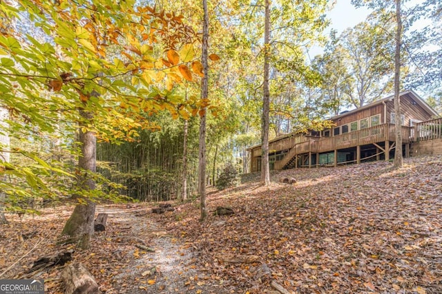 back of house featuring a wooden deck