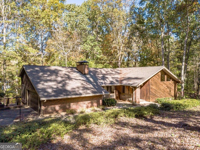 view of side of home featuring a garage