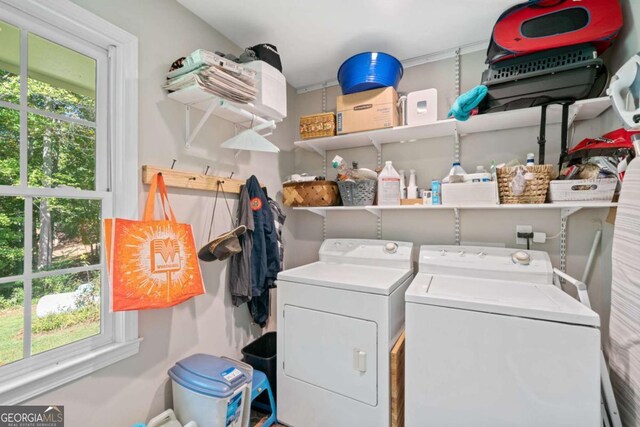 laundry area with washing machine and dryer