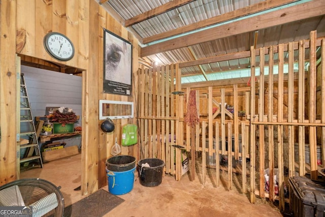 miscellaneous room with wood walls