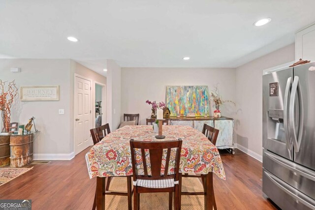 dining area with wood-type flooring