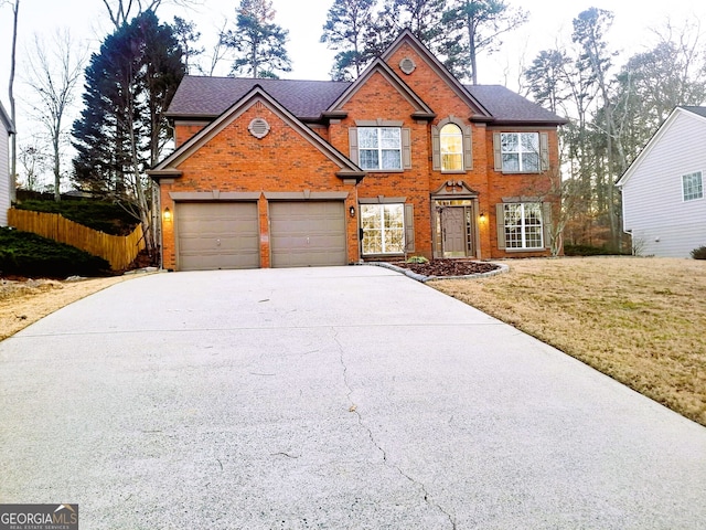 view of front of house featuring a front yard and a garage