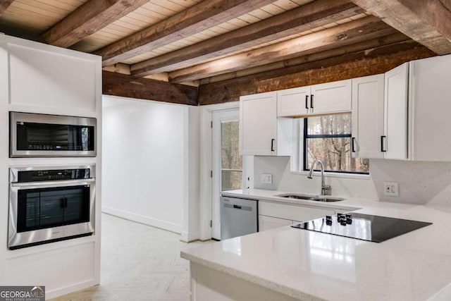 kitchen featuring appliances with stainless steel finishes, sink, wooden ceiling, beamed ceiling, and white cabinets