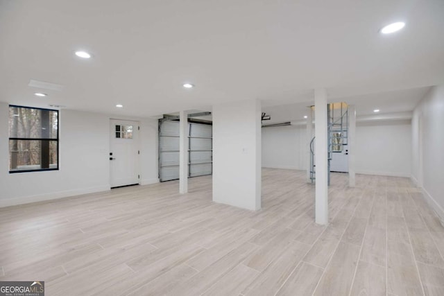 basement featuring light hardwood / wood-style flooring