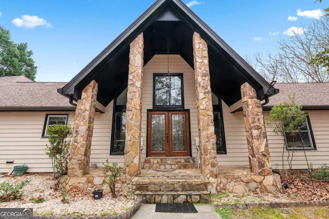 exterior space featuring a porch and french doors