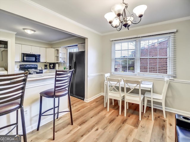 6520 Roswell Rd Unit 59, Sandy Springs, GA 30328 - kitchen with black appliances, open shelves, a chandelier, light wood-style floors, and white cabinetry