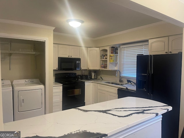 kitchen with separate washer and dryer, black appliances, white cabinetry, sink, and crown molding