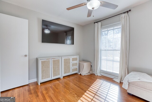 bedroom featuring ceiling fan and light wood-type flooring