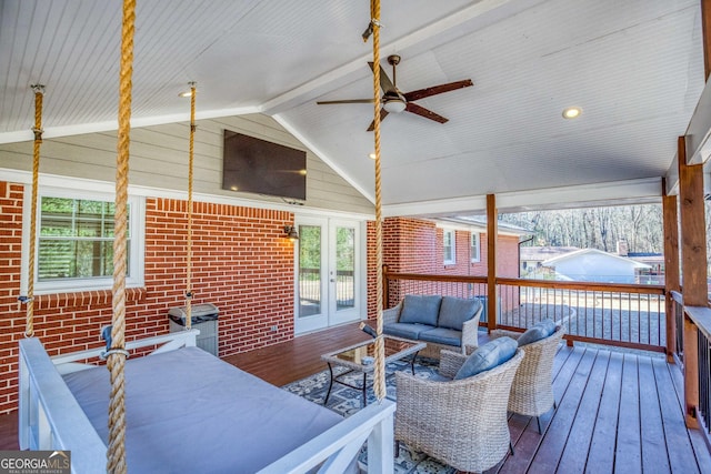 deck with ceiling fan, an outdoor hangout area, and french doors