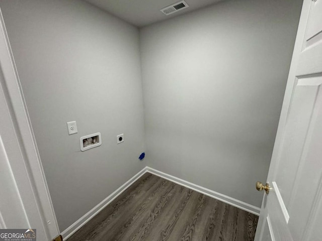 clothes washing area featuring hookup for an electric dryer, hookup for a washing machine, and dark hardwood / wood-style floors