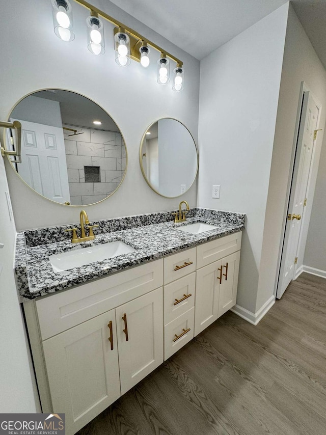 bathroom featuring vanity and wood-type flooring