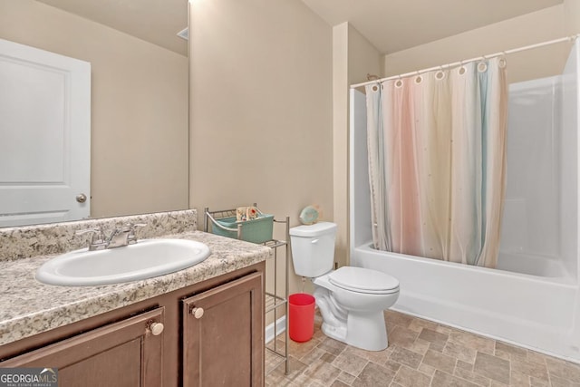 full bathroom featuring vanity, shower / tub combo, and toilet