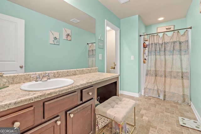 bathroom featuring vanity and walk in shower