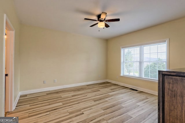 interior space with ceiling fan and light hardwood / wood-style floors